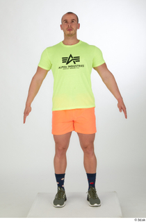 Joel a-pose dressed green sneakers orange shorts sports standing whole…